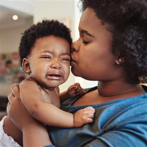 Parent holding crying infant. ECFE is here to help 763-506-1509